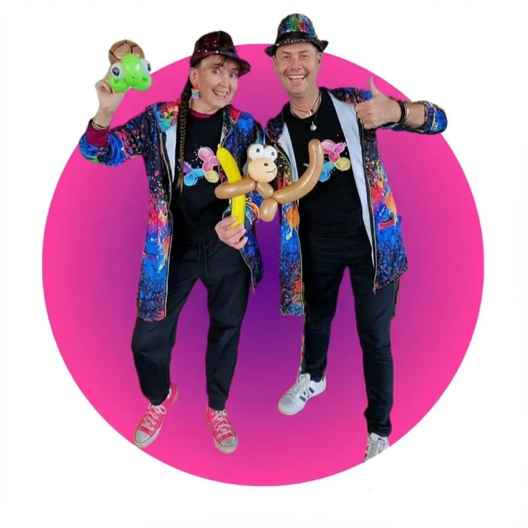 Kozi and Pinky holding ballon animals in Black and bright clothing